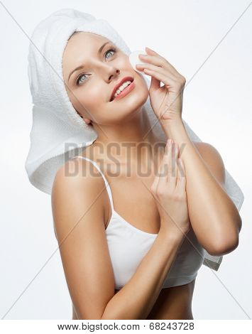 closeup portrait of attractive  caucasian smiling woman blond isolated on white studio shot lips toothy smile face hair head and shoulders blue eyes towel mirrow cleaning cotton disc