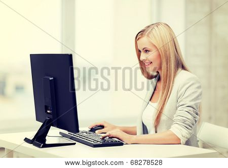 picture of smiling businesswoman using her computer
