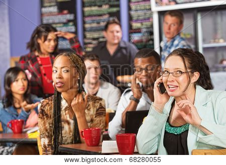 Rude Woman On Phone In Cafe