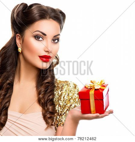 Beauty Pin up girl with holiday gift box in her hand. Retro woman portrait. Vintage styled make up and hairstyle. Pinup style model lady isolated on white background