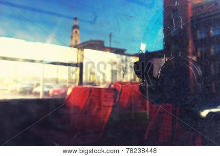 City Through The Glass Of The Bus To The City