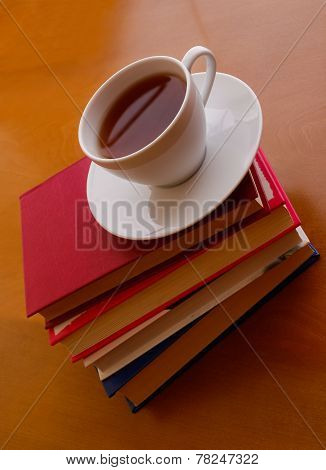 Cup Of Tea And Stack Of Books