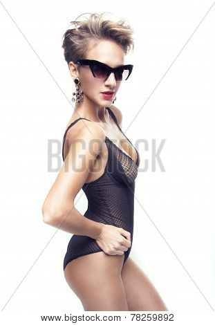 Posing girl with curly hair in sunglases.