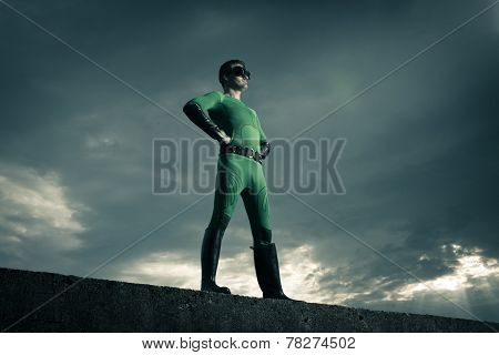 Confident Superhero Standing On A Wall