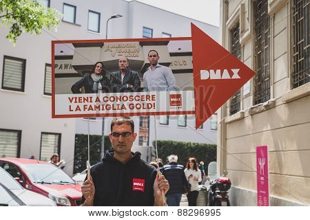 Guy Holding Dmax Sign At Fuorisalone During Milan Design Week 2015