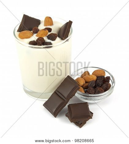 Yogurt desert with chocolate, almonds and raisins isolated on white