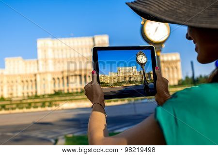 Photographing parliament building in Bucharest