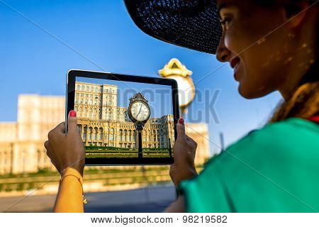 Photographing parliament building in Bucharest