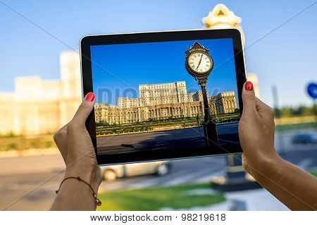Photographing parliament building in Bucharest