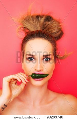 attractive model woman taste green pepper