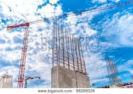Construction Site With Industrial Crane And Close Up Of Reinforced Concrete Walls