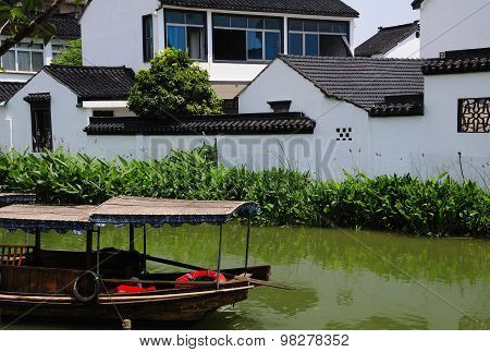 Empty Boat on Water Canals of Luzhi
