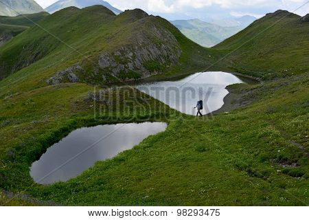 Mountain Landscape With Lakes And Tourist