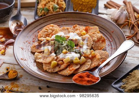 Indian Streetfood Papri Chaat Garnished And Served With Yoghurt