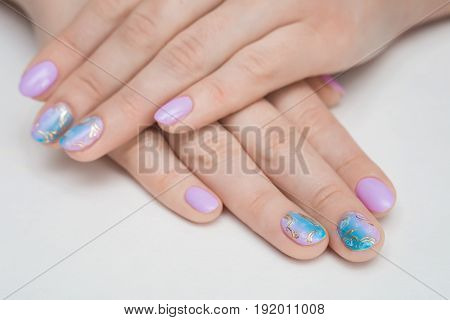 Close-up picture of beautiful nails girl. A good idea for the advertising of cosmetics for manicure. Great idea for advertising nail polish.