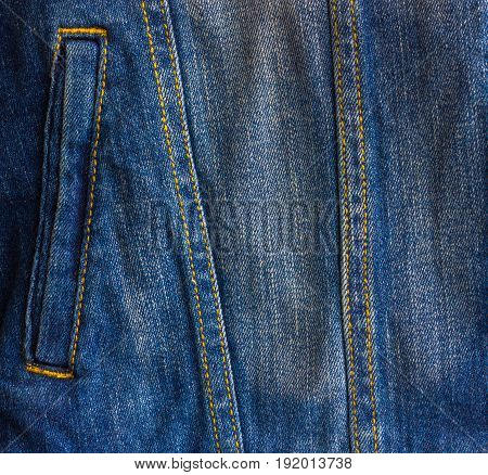 Pocket of a worn denim jacket. he pocket of the jacket is large-sized on a denim women`s jacket.