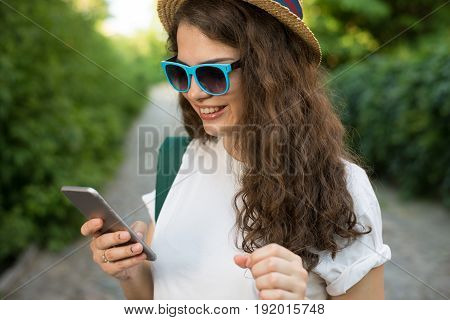 Girl Traveler Using Smartphone On Street
