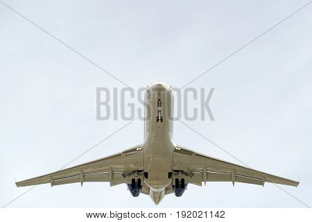The underside of a modern airplane and its landing gear