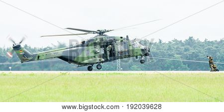 BERLIN GERMANY - JUNI 01 2016: Landing helicopter NH90 of the German Army. Exhibition ILA Berlin Air Show 2016