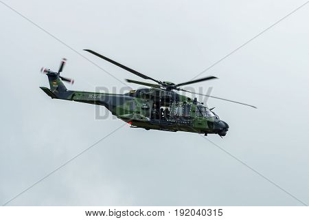 BERLIN GERMANY - JUNE 01 2016: Helicopter NH90 of the German Army. Demonstrative performance. Exhibition ILA Berlin Air Show 2016