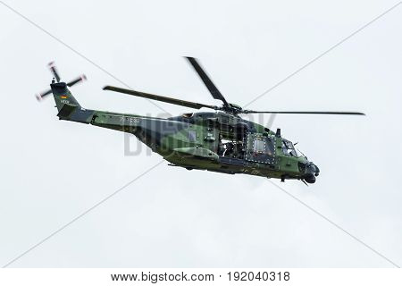 BERLIN GERMANY - JUNE 01 2016: Helicopter NH90 of the German Army. Demonstrative performance. Exhibition ILA Berlin Air Show 2016