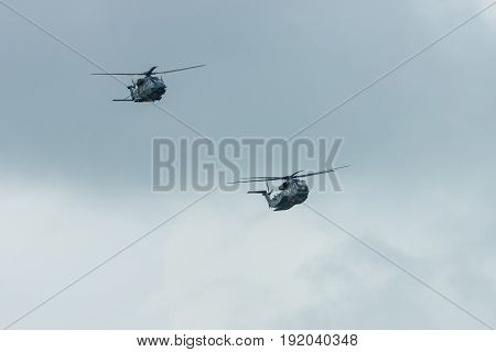 BERLIN GERMANY - JUNE 01 2016: Heavy-lift cargo helicopter Sikorsky CH-53 Sea Stallion and NHIndustries NH90 of the German Army. Demonstrative performance. Exhibition ILA Berlin Air Show 2016