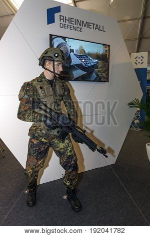 BERLIN GERMANY - JUNE 01 2016: The stand of Rheinmetall Defence. Modern equipment a soldier of the German army (Bundeswehr). Exhibition ILA Berlin Air Show 2016.
