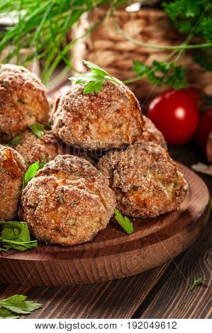 Stack Of Baked Meatballs On A Chopping Board