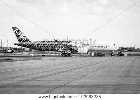 BERLIN GERMANY - JUNE 02 2016: The newest Airbus A350 XWB at the airfield. Black and white. Exhibition ILA Berlin Air Show 2016