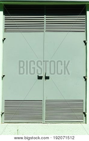 Protective metal doors of transformer station electric cabinet. Vertical.