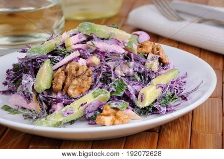 salad red coleslaw with slices of avocado apple nuts parsley dill seasoned yoghurt sauce