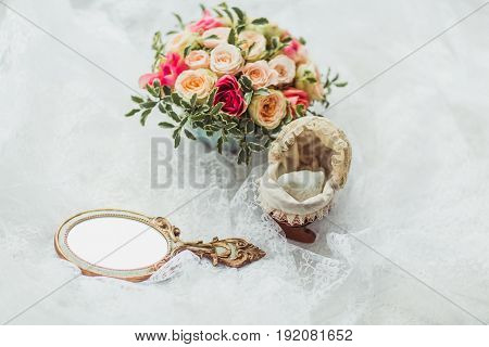 Luxury shoes and bride jewel mirror on the sofa