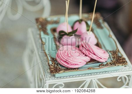 Beautiful multicolored decorated baked sweet tasty candy bar desserts