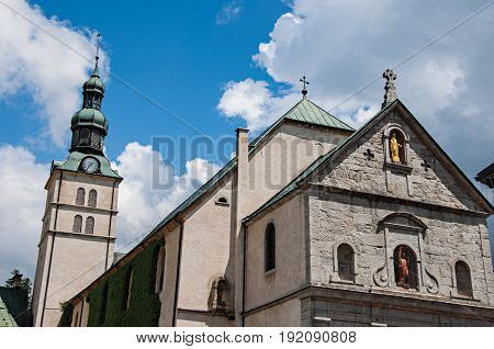 Megève, France - June 25, 2016. Close-up of Church of Saint Jean Baptiste and steeple in Megève, a famous ski resort located in Haute-Savoie Province, near the Mont Blanc in the French Alps