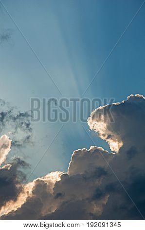 Dramatic clouds in Saint-Gervais-Les-Bains/Le Fayet, French Alps, blue sky with sunset light through the clouds