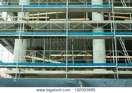 Construction site close up. Building construction with scaffolding.