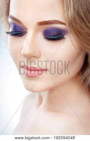 High fashion look close up beauty portrait of beautiful young woman model with bright makeup with perfect clean skin