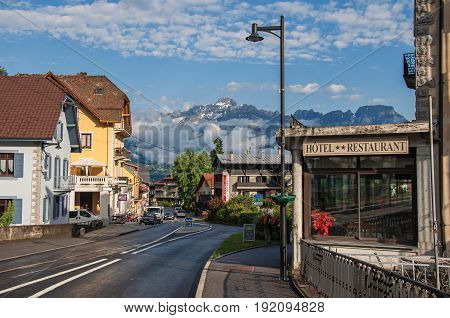 Saint-Gervais-Les-Bains, France - June 25, 2016. Street with cars and shops in the district of Le Fayet, a famous ski resort located in Haute-Savoie Province, near the Mont Blanc in the French Alps