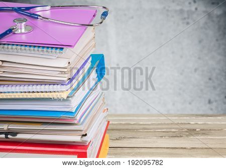 Stack stethoscope books reference health care med school color