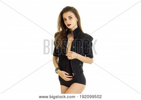 Pretty woman in high panties and jacket without bra looks at the camera isolated on white background