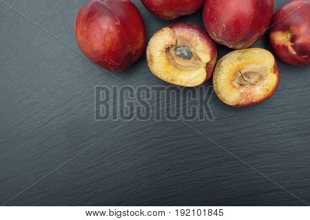 Ripe Nectarine On Black Background Of Slate Or Stone