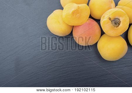 Ripe Apricot On Black Background Of Slate Or Stone