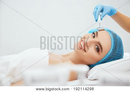 Beautiful Woman Lying On Procedure Of Galvanization