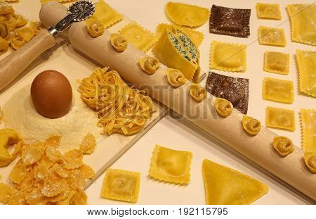 Pasta Of Many Sizes With Wooden Rolling Pin And Tortellini And R