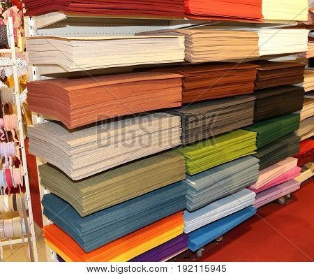 Shelf Full Of Fabrics For Sale At The Fair Of Decoration