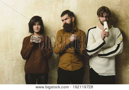 Friends With Drinks On Beige Wall.