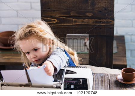 Kid Or Small Boy Or Businessman Child With Typewriter