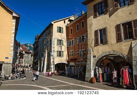Annecy, France - June 28, 2016. Colorful street with old buildings and people in the city center of the historic Annecy, department of Haute-Savoie, Auvergne-Rhône-Alpes region, south-eastern France