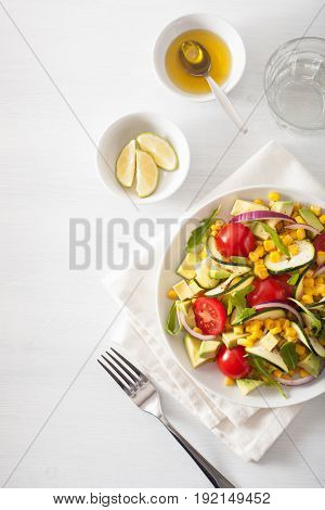 spiralized courgette salad with sweetcorn tomato avocado, healthy vegan meal