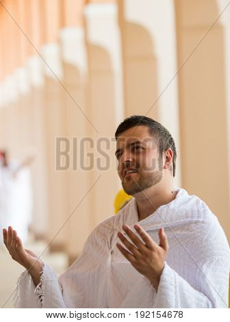 Muslim man enjoying his visit to holy mosque